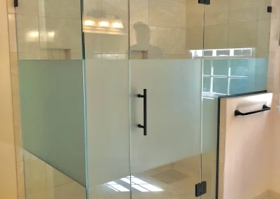 Image of tan shower area with acid etched privacy screen from Shower Door King.