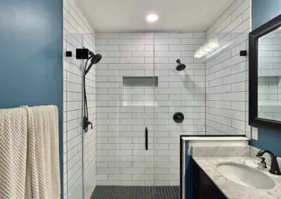 Image of white and black contemporary shower from ShowerDoorKing.