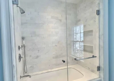 Image of white and blue contemporary shower from ShowerDoorKing.